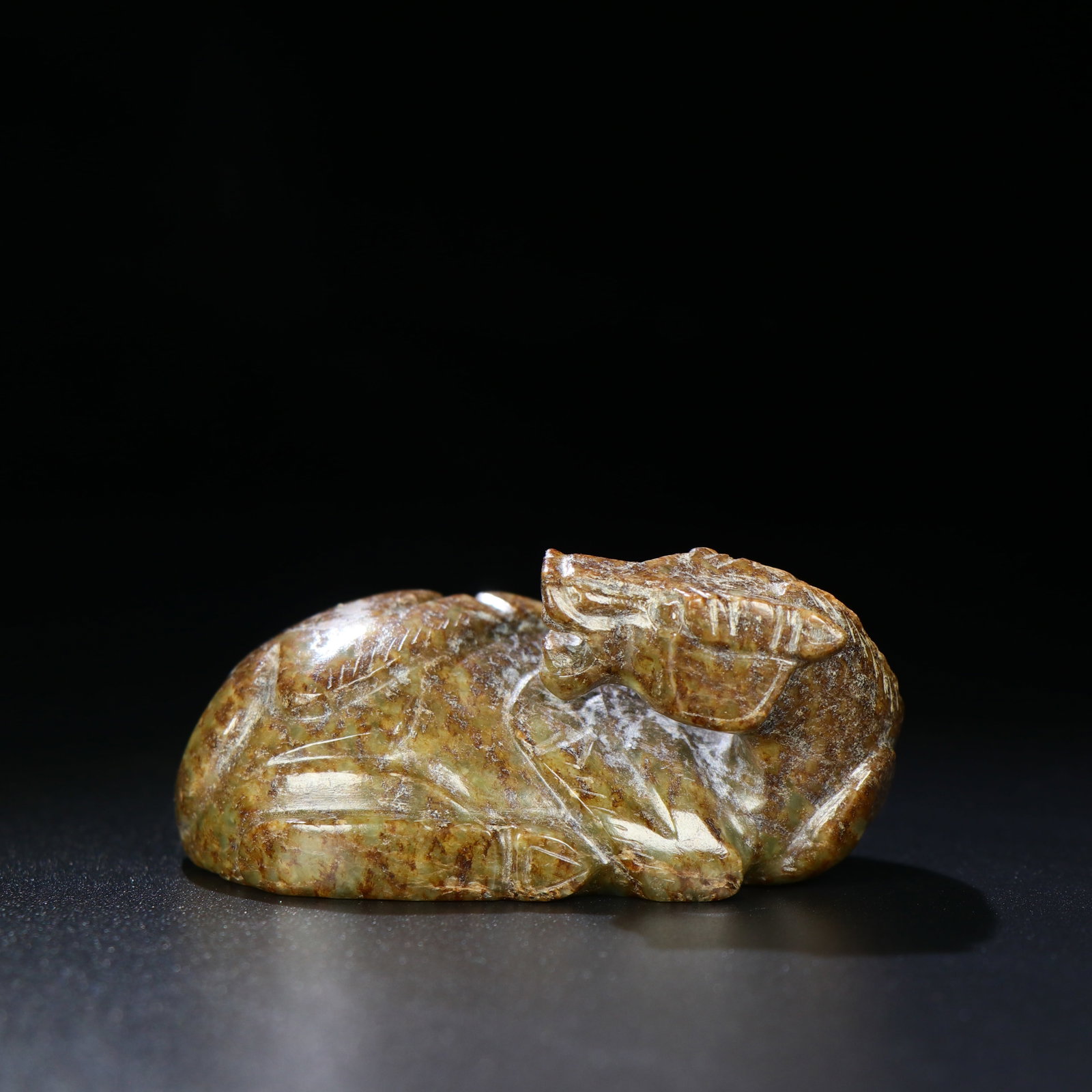 A Chinese Carved Jade Horse Statuette: A Chinese Carved Jade Horse Statuette. Lg. 7cm, Wd. 4.5cm, Wt. 138g