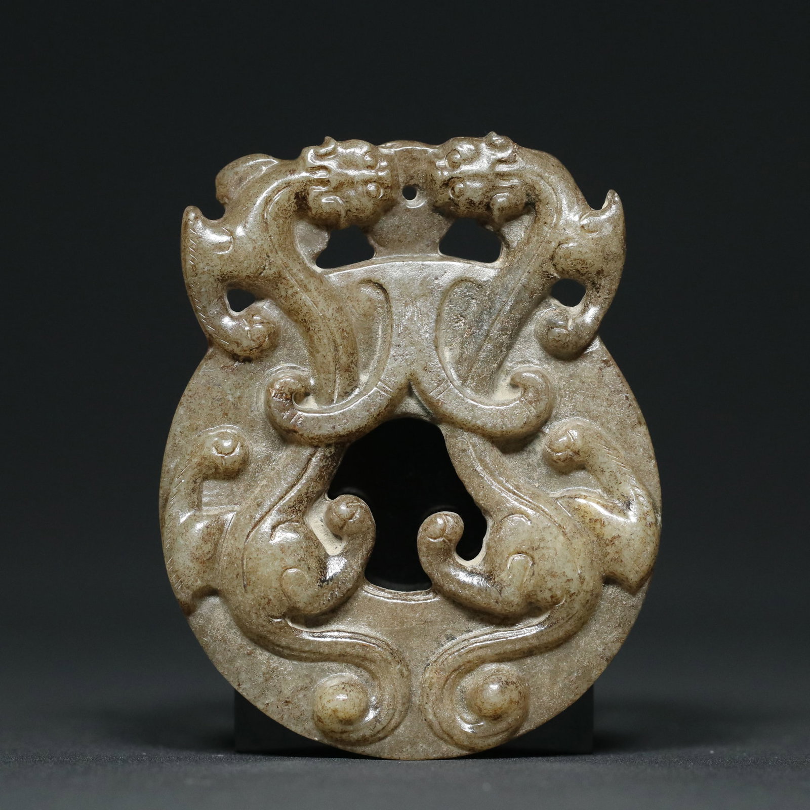 A Chinese Carved Jade Dragon Pendant: A Chinese Carved Jade Dragon Pendant. Lg. 6.9cm, Wd. 5.6cm, Th. 1cm, Wt. 54.2g