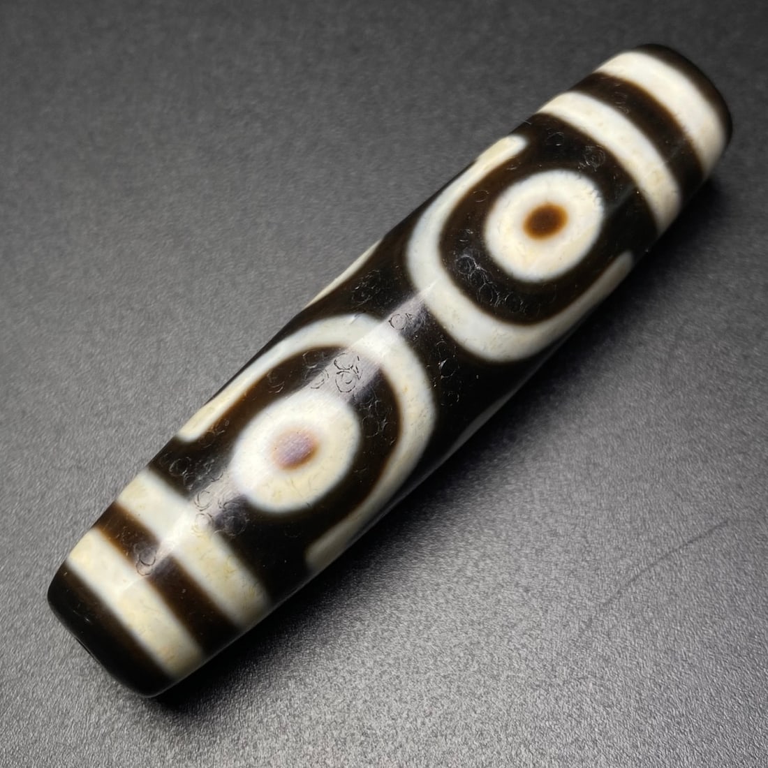 A Chinese Carved Agate DZI Bead (1 of 9)