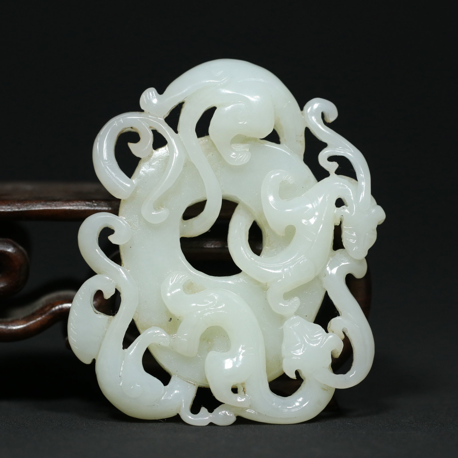 A Chinese Carved Jade Dragon Pendant: A Chinese Carved Jade Dragon Pendant. Lg. 7.1cm, Wd. 5.9cm, Th. 1.4cm, Wt. 60g