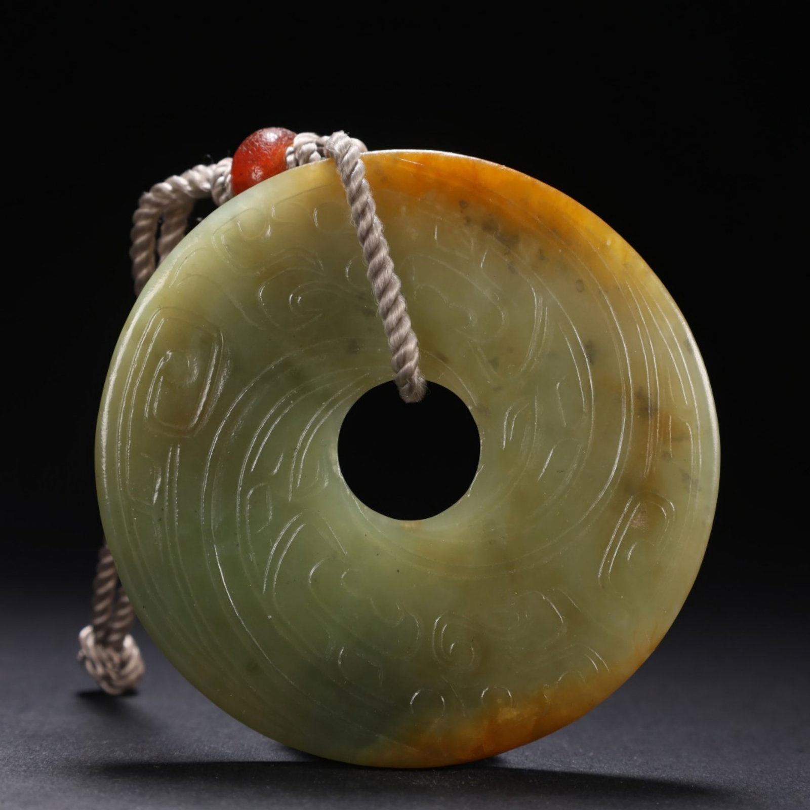 A Chinese Carved Jade Ring Pendant: A Chinese Carved Jade Ring Pendant. Wd. 6.9cm, Th. 0.6cm, Wt. 66g