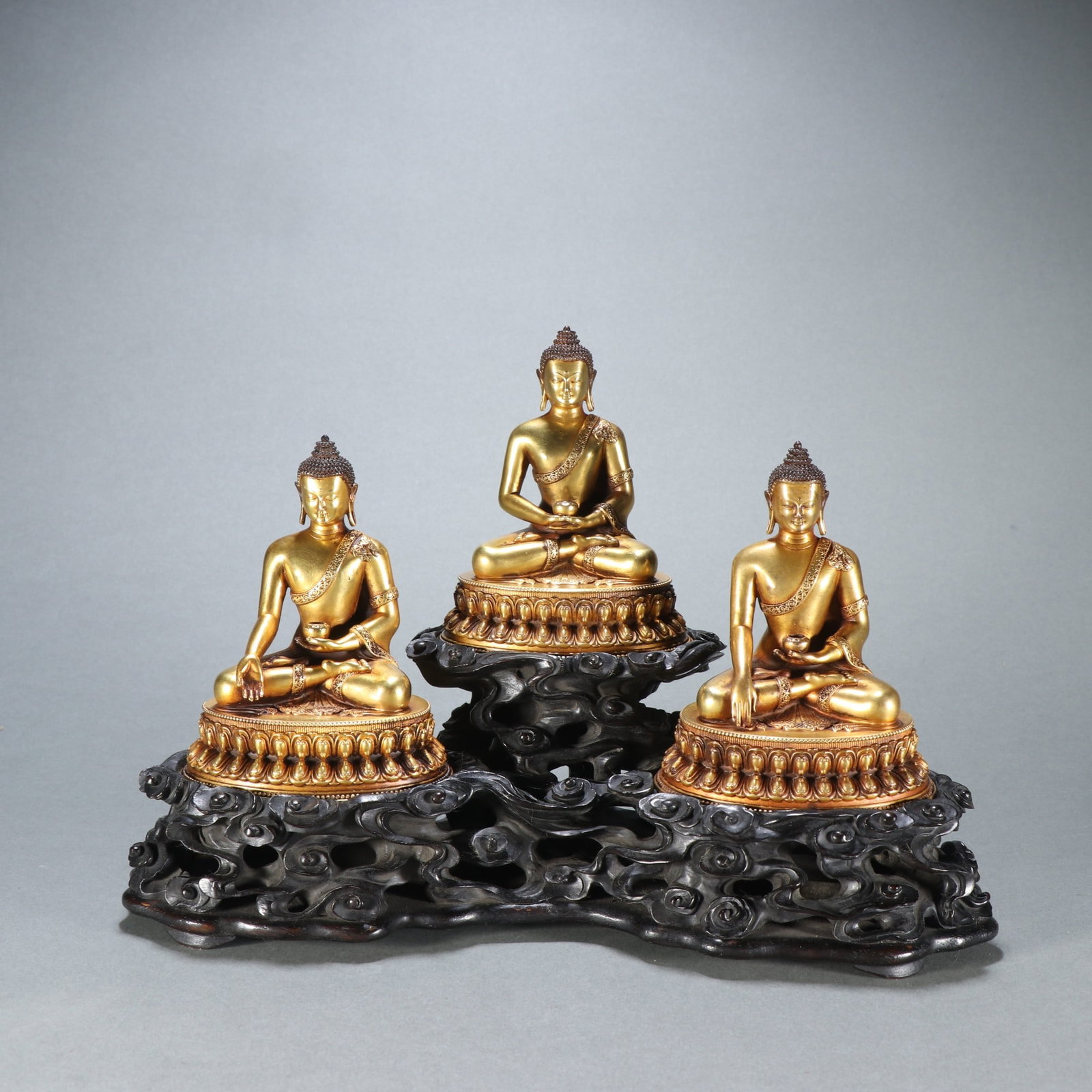 A Set of Three Chinese Gilt Bronze Figures of Buddha (1 of 9)