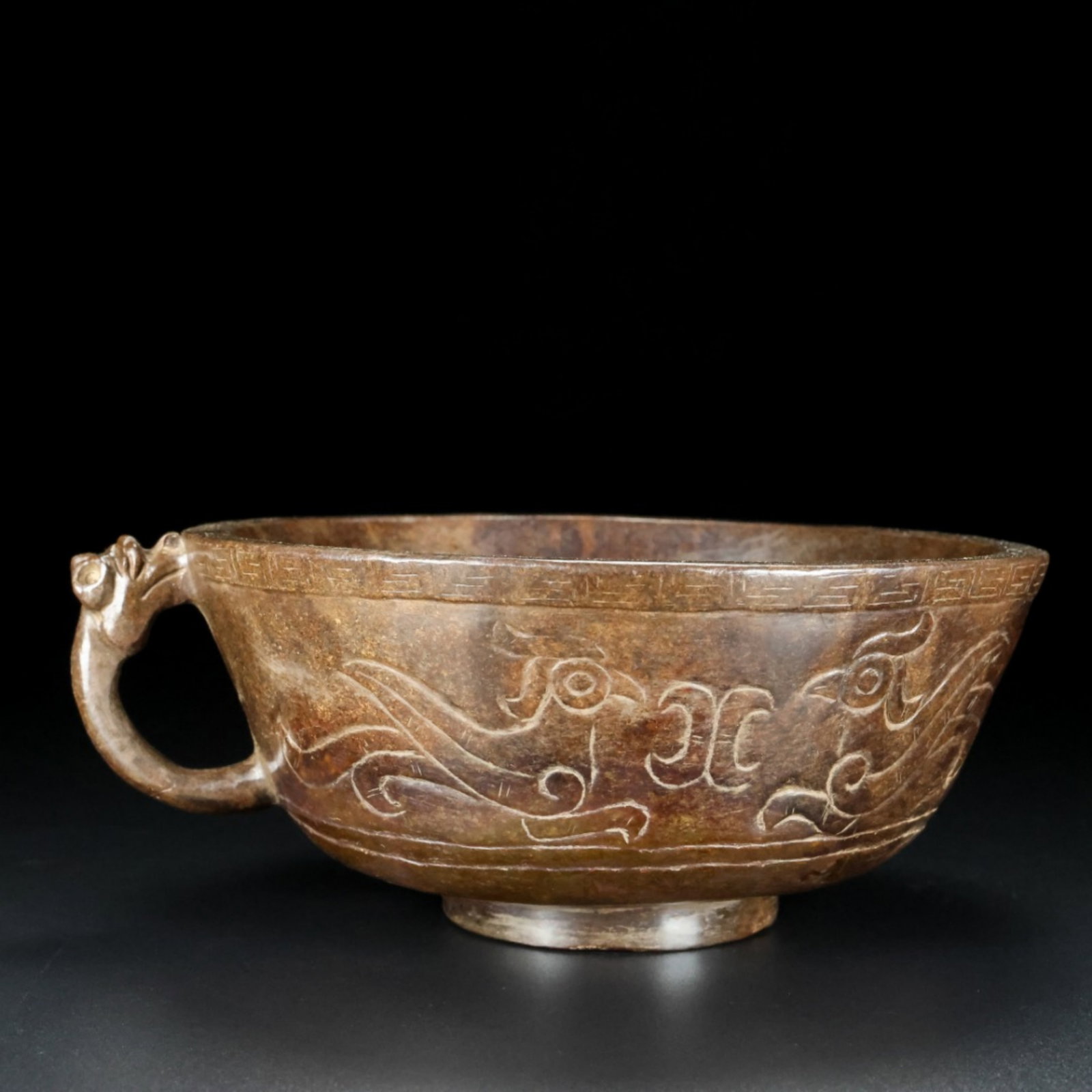 A Chinese Carved Jade Bowl: A Chinese Carved Jade Bowl. Wt. 530g, Lg. 16.2cm, Wd. 14.1cm, Ht. 6.5cm