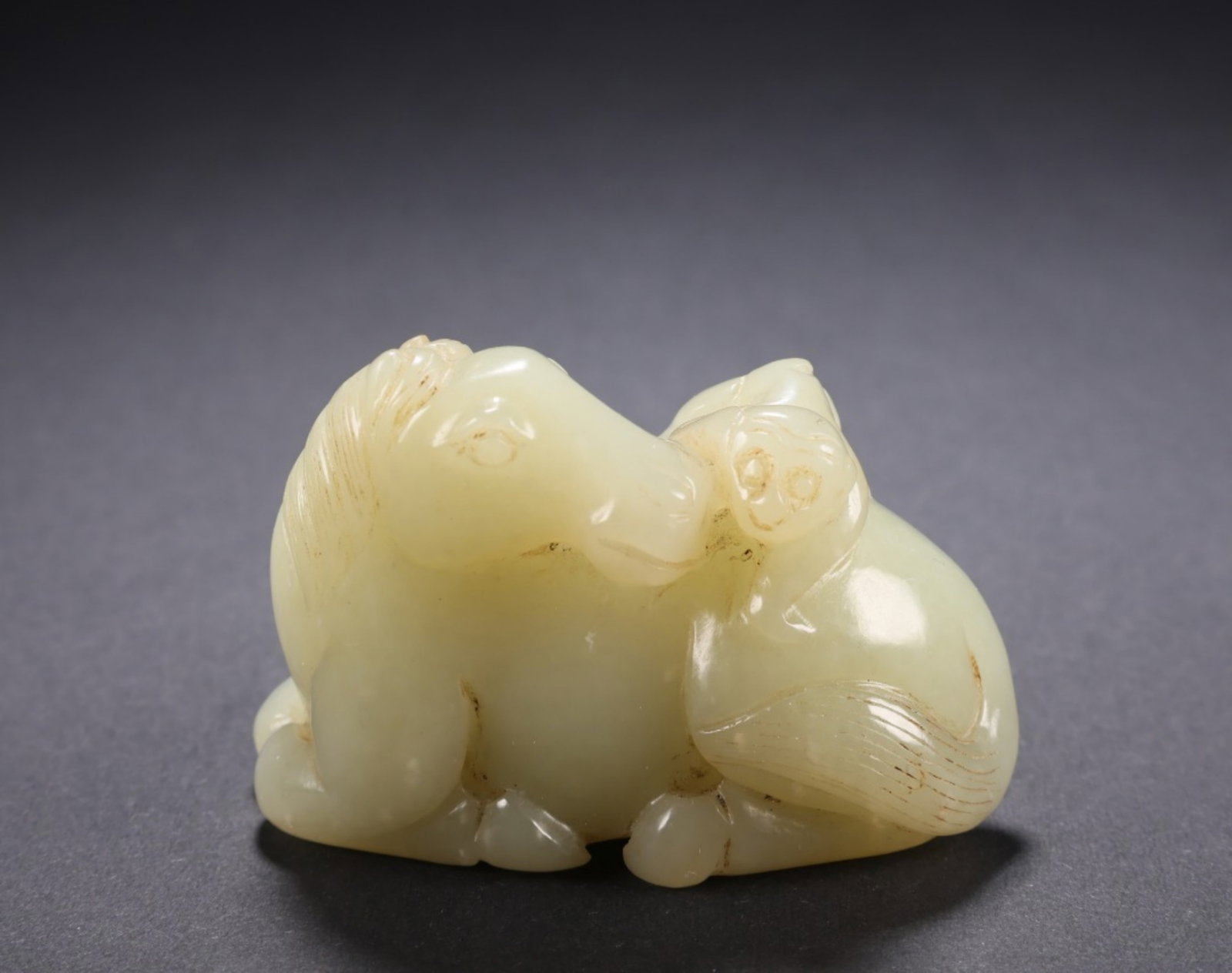 A Chinese Carved Jade Horse and Monkey Statuette: A Chinese Carved Jade Horse and Monkey Statuette. Lg. 6cm, Wd. 3.3cm, Ht. 4cm, Wt. 105g