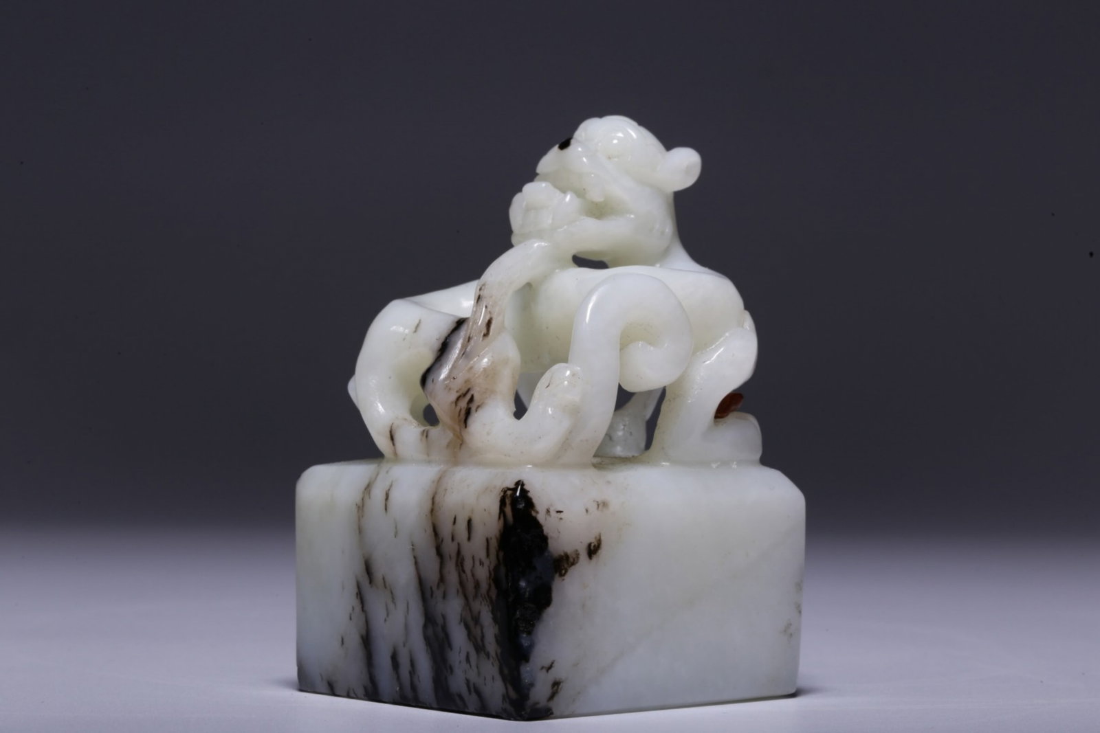 A Chinese Carved Jade Seal with Dragon Handle: A Chinese Carved Jade Seal with Dragon Handle. Ht. 7.2cm, Lg. 4.8cm, Wd. 4.6cm, Wt. 234g
