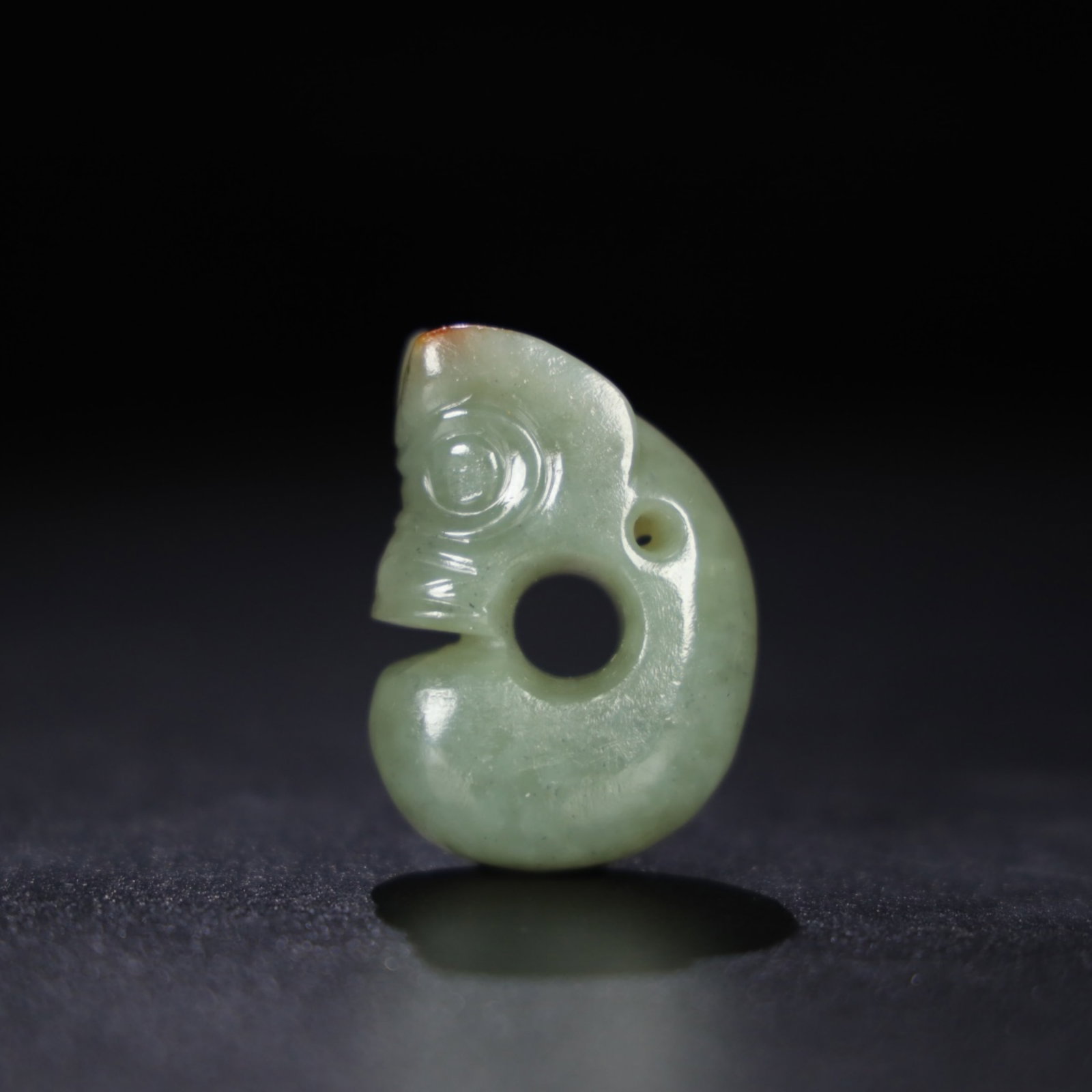 A Chinese Carved Jade Dragon Pendant: A Chinese Carved Jade Dragon Pendant. Lg. 3.4cm, Wd. 1.7cm, Ht. 4.9cm, Wt. 46.8g