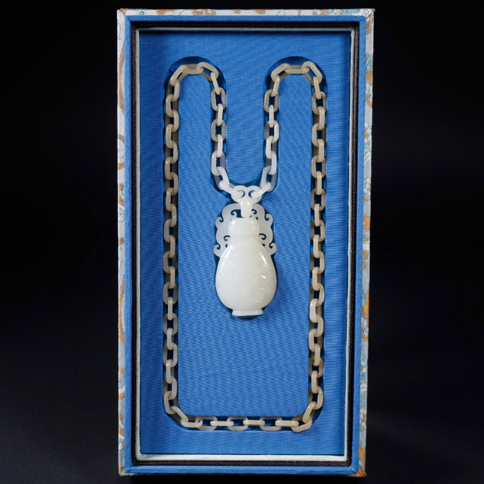A Chinese Carved Jade Necklace: A Chinese Carved Jade Necklace. Lg. 3.4cm, Wd. 1.8cm, Ht. 6.2cm, Wt. 87g