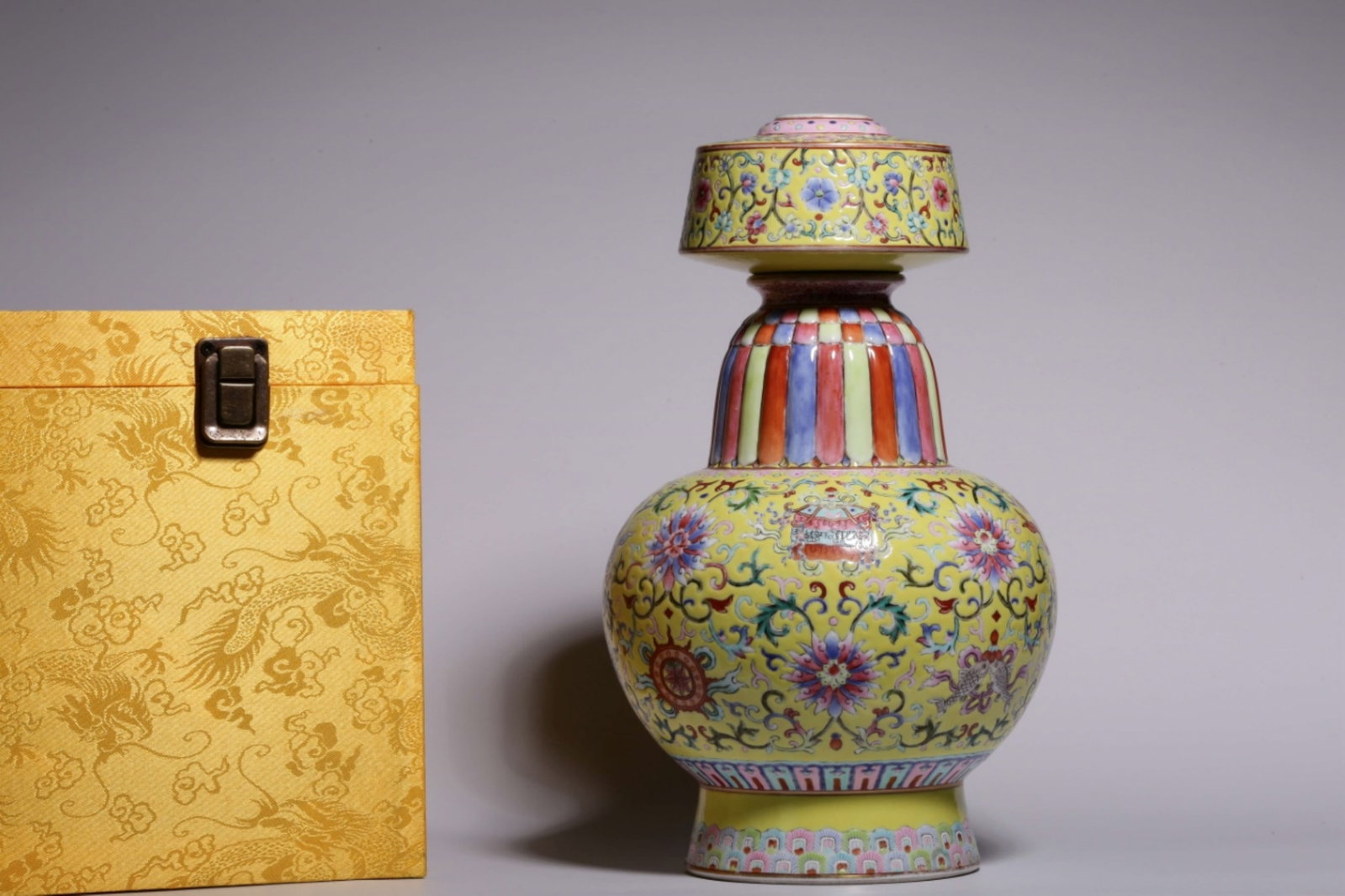 A Chinese Yellow Ground Famille-Rose Porcelain Water Pot: A Chinese Yellow Ground Famille-Rose Porcelain Water Pot. Ht. 26.6cm, Diam. 10.2cm