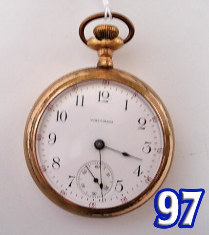 Pocket Watch: American Waltham Pocket Watch with a gold filled case, a white dial, Arabic numbers, seconds dials and red seconds numbers around dial. The plate movement #18979864 and the case # is 1195851. *noting