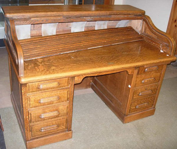 Large oak desk with roll top *note roll top needs: Large oak desk with roll top *note roll top needs repair, 43"h x 59 1/2"w x 36"d