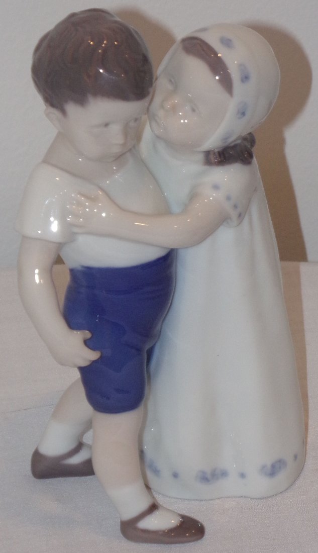 B&G Figure: B&G porcelain figurine, young boy & girl, girl attempting to kiss boy on cheek, #1614 CH (incised I.P.I.), approx. 7” T