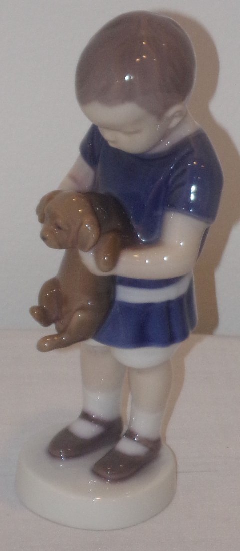 B&G Figure: B&G porcelain figurine, young boy holding a puppy, #1747, approx. 6½” T