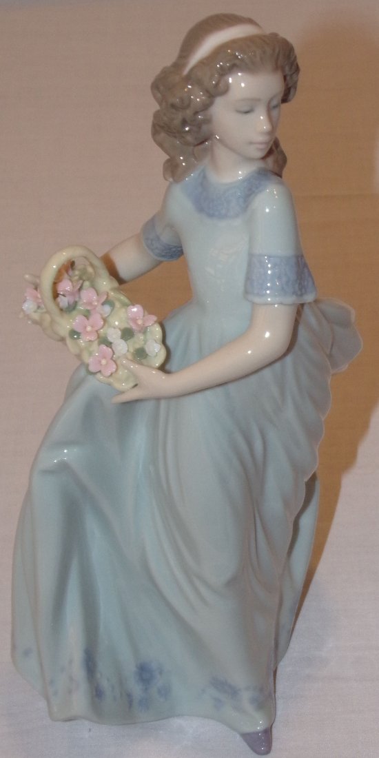 Lladro Figure: Lladro porcelain figurine, young girl in long flowing pale green dress holding basket w/flowers, incised 6130, approx. 9¼” T