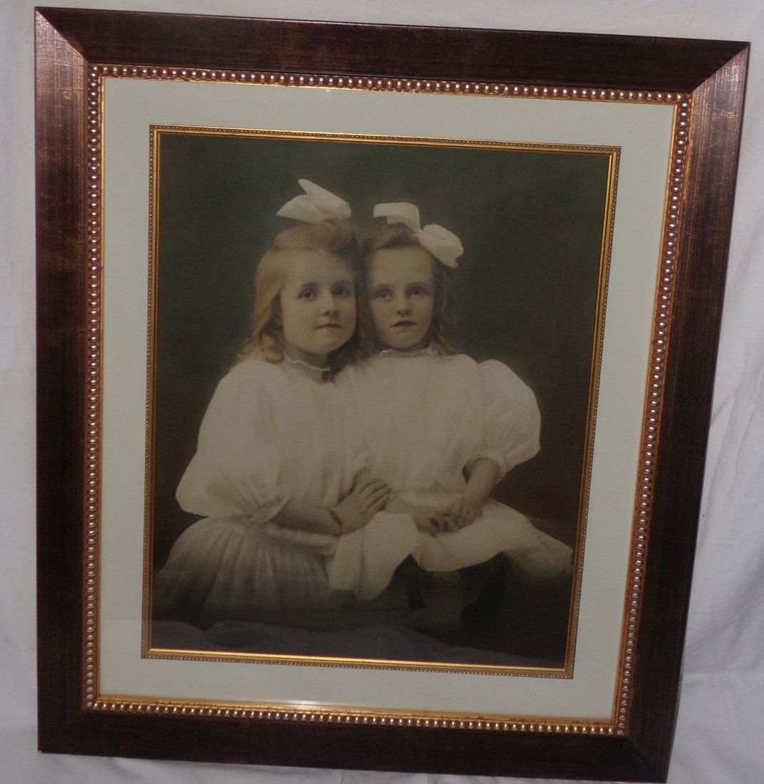 Framed Photograph - 2 Young Girls: Framed photograph of 2 young blonde hair girls, hands clasped, bows in hair, white dresses, approx. image 18” x 14½”, overall frame 25¾” x 22¼”