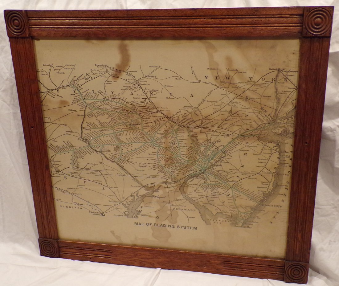 Framed Railroad Map: Vintage railroad map entitled, “Map of Reading System”, shows foxing, brown staining & discoloration mounted in a late Victorian oak frame with square molded corners, holes drilled on all sides of