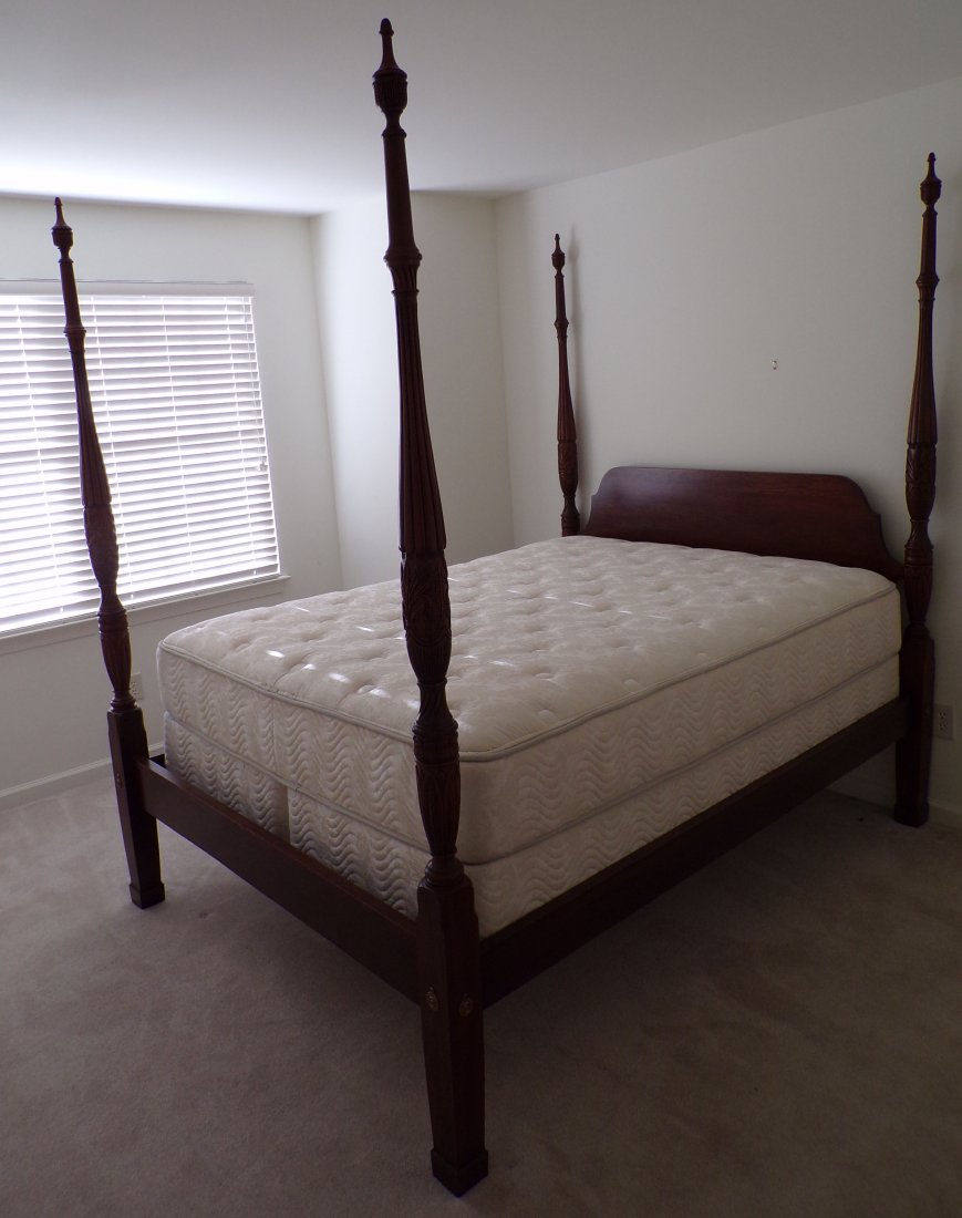 Stylized Chippendale Queen Size Four Poster Bed: Stylized Chippendale cherry queen size four poster bed, cut out headboard, the posts with urn form finials, fluted carving with leaves ending square tapered legs with block/Marlborough style feet, app