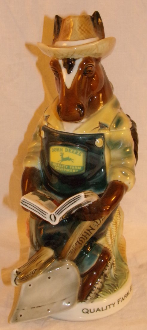 Figural Porcelain Beer Stein: Figural porcelain beer stein with lid, work horse wearing a straw hat, marked John Deere Collectible Plow Horse Stein, mfg. sold by M. Cornell Importers, Inc., made in Germany, Limited Edition No. 131