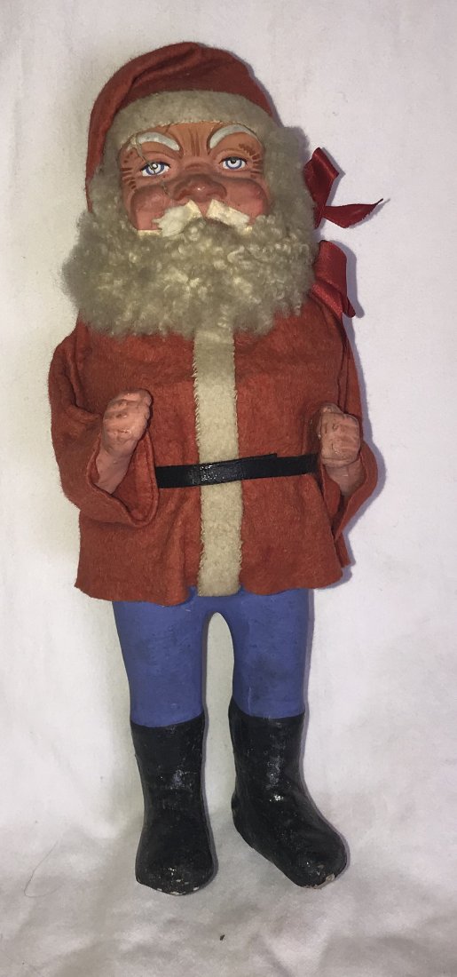 Vintage Papier Mache Santa Claus: Vintage papier mache Santa Claus figure in traditional garb, crack visible on right eyebrow down to base of nose, shows old wear & roughness on boots, upper body under jacket w/old damage, approximate