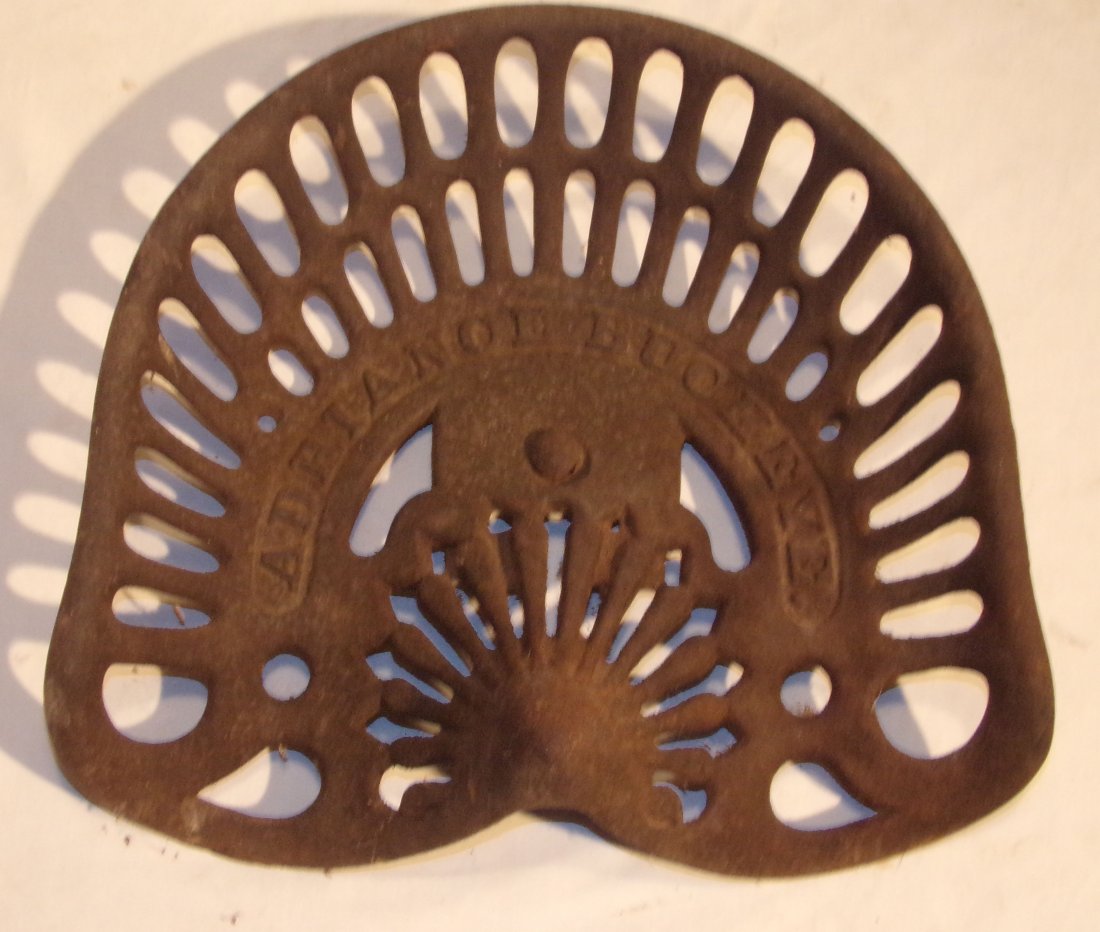 Cast Iron Tractor/Farm Implement Seat: 100.Cast iron tractor/farm implement seat marked Adriance Buckeye, some rust, good condition, 18” w x 15” D