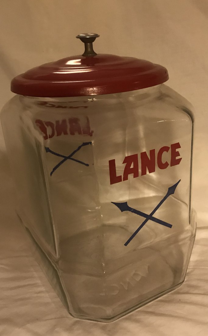 Vintage Lance Cracker Jar: Vintage octagonal glass Lance Cracker jar w/round metal lid painted red and chrome knob, blue crossed spear mark, knob dented, 12” T x 7” W x 8 ½” D
