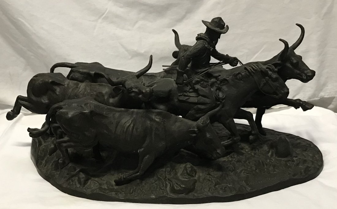 RECAST Frederic Remington Sculpture: RECAST Frederic Remington bronze sculpture, cowboy surrounded by 4 longhorn steers mounted on an oval base, approximately, 14 ½” T x 28 ½” W x 13 ½” D (base width 26 ½” )