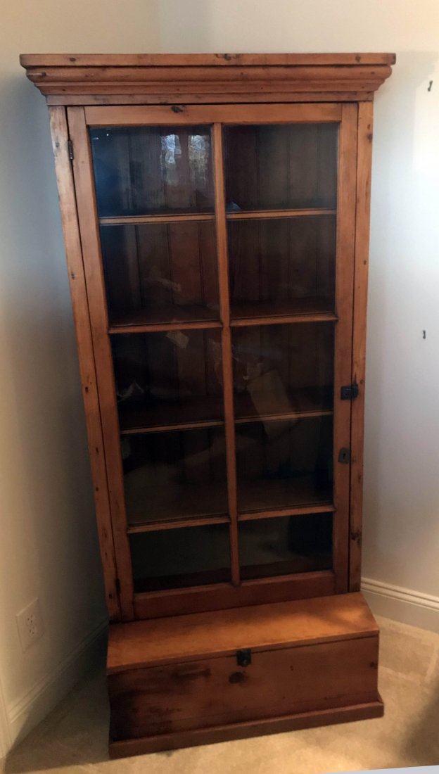 FURNITURE, ACCESSORIES, COUNTRY COLLECTIBLES, TOYS,: Country pine stepback cabinet having a molded cornice over a single door with 10 lights opening to 4 shelves on a base with small hinged fall front blind door, refinished, 67 ¾” T x 31 ¾” W x 16