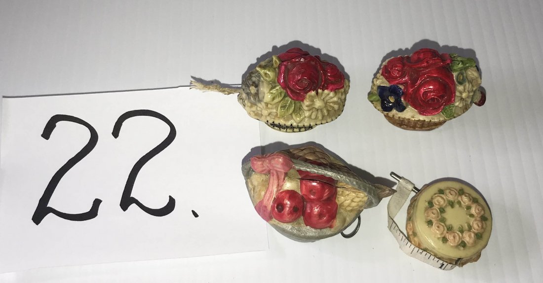 FURNITURE, ACCESSORIES, COUNTRY COLLECTIBLES, TOYS,: Grouping of (4) Germany celluloid tape measures including: (2) floral baskets (1 missing lady bug pull), fruit basket with metal pull AND round “cake type” design with pink roses on cream backgrou