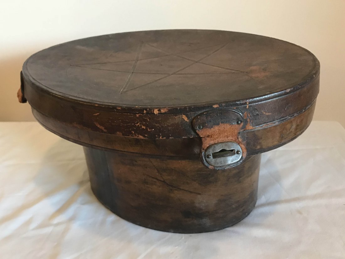 FURNITURE, ACCESSORIES, COUNTRY COLLECTIBLES, TOYS,: Vintage top hat marked Ben Miller Hat Co., St. Louis AND an original brown hat box with paper interior, 5 pointed star design, latches and hinge all show damage, 6 5/8” T x 12 ½” W x 10 5/8” D