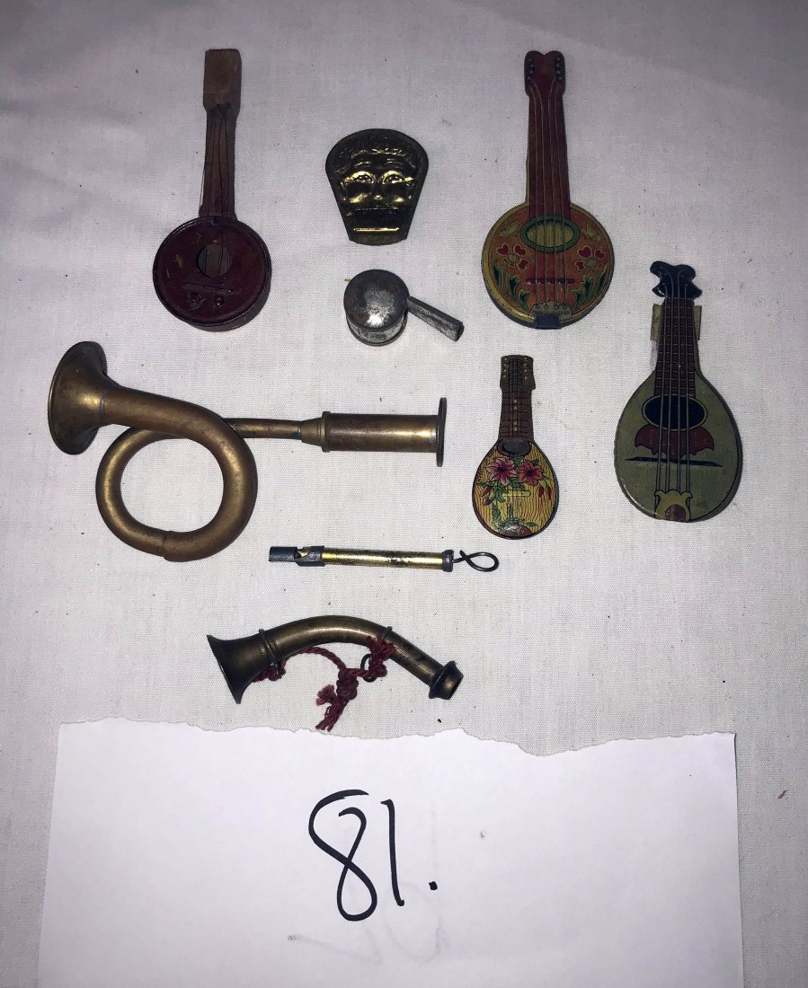 FURNITURE, ACCESSORIES, COUNTRY COLLECTIBLES, TOYS,: Grouping of vintage metal toys: a tin banjo; tin mandolin noise maker; tin mandolin whistle; small brass whistle w/man's face; tin round whistle; (2) brass horns; tin whistle; primitive tin/wooden whi
