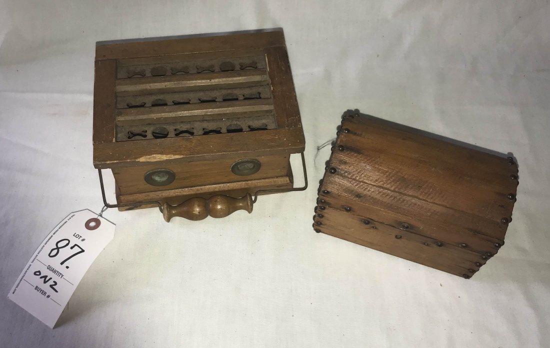 FURNITURE, ACCESSORIES, COUNTRY COLLECTIBLES, TOYS,: Unusual child's wooden footwarmer, the lid w/"X & O" pierced tin panel, interior lined in tin, tin hod damaged, wirework swing handle, lid shows some wood loss on back edge, 3 1/2" T x 7 1/2" W x 5 1/