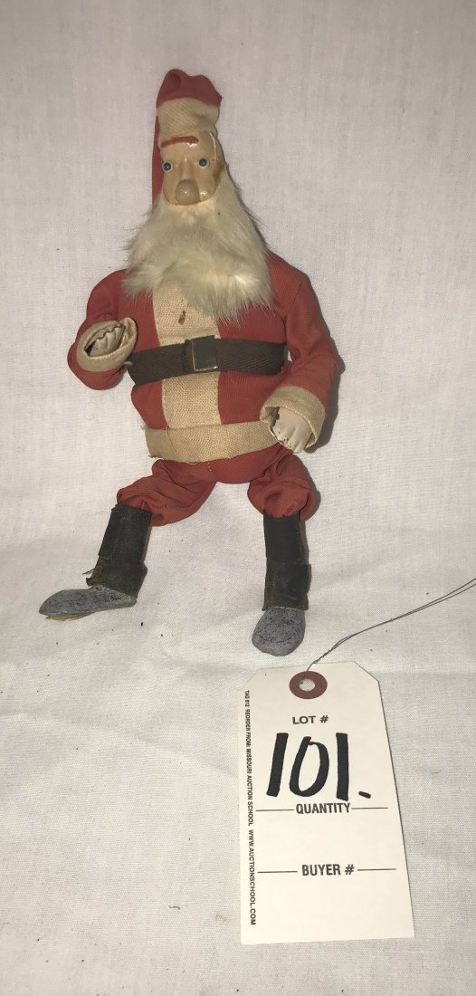 FURNITURE, ACCESSORIES, COUNTRY COLLECTIBLES, TOYS,: Vintage Santa Claus figure, seated position w/bright blue eyes, celluloid head, tin hands, lead/weighted shoes, black cloth leggings, uniform shows some fading, soiling and staining, 8" T