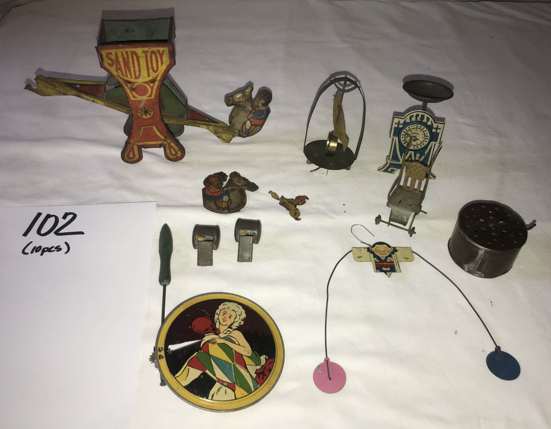 FURNITURE, ACCESSORIES, COUNTRY COLLECTIBLES, TOYS,: Grouping of vintage penny and tin litho toys; rotating bird on stand; round noise maker w/crank handle; (2) miniature tin whistles; toy see saw w/2 figures on horseback, 1 figure needs to be reattache