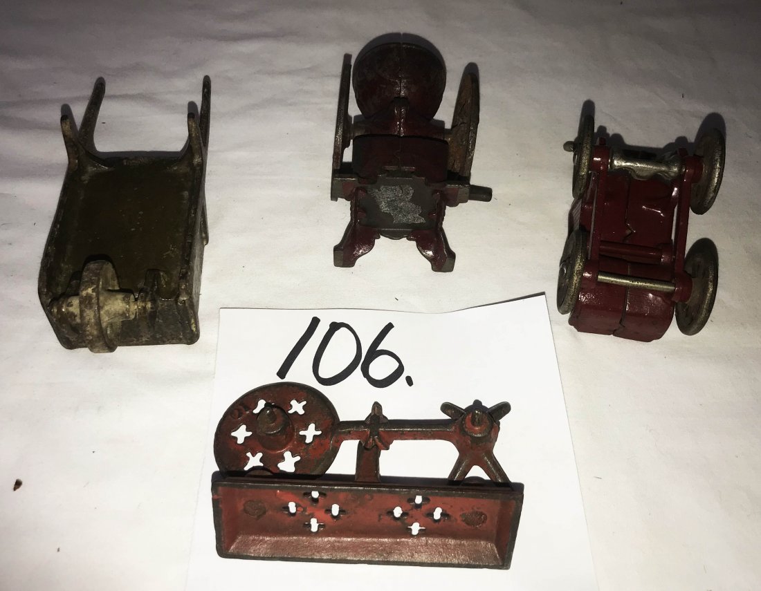 FURNITURE, ACCESSORIES, COUNTRY COLLECTIBLES, TOYS,: Grouping of antique cast iron toys: double wheel coffee grinder w/drawer-red paint, 4" T; baby carriage, red paint, 4" T; wheel barrow, brownish/yellow paint, 6 1/2" T; balance scale (no pan), red pai