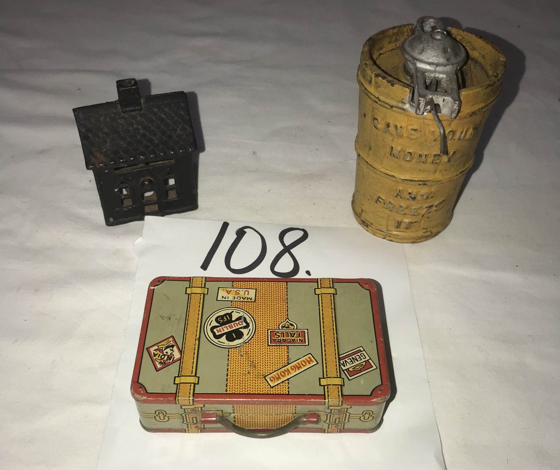 FURNITURE, ACCESSORIES, COUNTRY COLLECTIBLES, TOYS,: Grouping of 3 vintage still banks: cast iron ice cream freezer marked Save Your Money And Freeze It painted yellow and silver, marked USA, 4" T x 2 1/2" diameter; tin suitcase marked with destination 