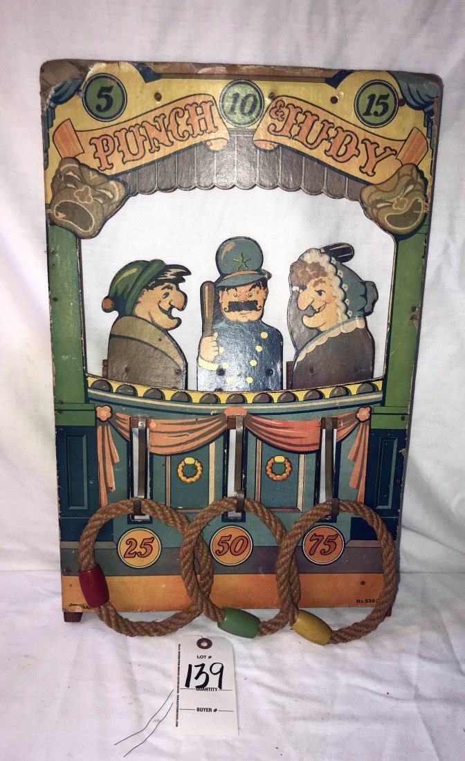 FURNITURE, ACCESSORIES, COUNTRY COLLECTIBLES, TOYS,: Vintage Punch and Judy ring toss game, wooden frame w/paper decoration made by American Toy Works, Inc. No. 539G, original condition, some paper loss at corners, 19 1/2" T x 12 3/4" W