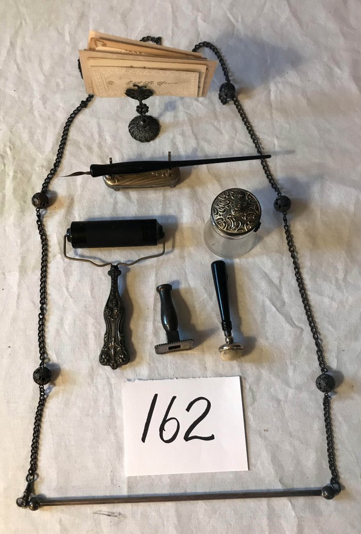FURNITURE, ACCESSORIES, COUNTRY COLLECTIBLES, TOYS,: Group of 7 desk/writing items: glass bottle w/brush w/plated silver handle; small oval nickel plated pen holder w/inkwell and pen w/black handle; small pad w/black handle and raised plated silver desi