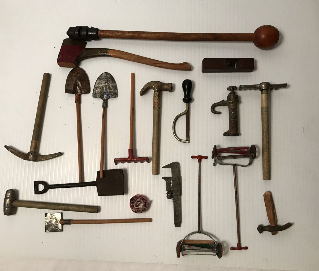 FURNITURE, ACCESSORIES, COUNTRY COLLECTIBLES, TOYS,: Group of toy yard and hand tools: rakes, pick, shovels, hammers, axe, wrench, hack saw, (2) rotary lawn mowers, wooden block plane, cap stick