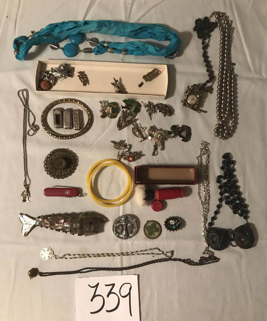 HANDCRAFTED JEWELRY, STERLING AND PLATED SILVER,: Grouping of miscellaneous costume jewelry: abalone fish, shows some gills missing; mother of pearl necklace, Monet bead necklace (silver colored), filigree hat pin; (3) religious; tin owl heads, glass
