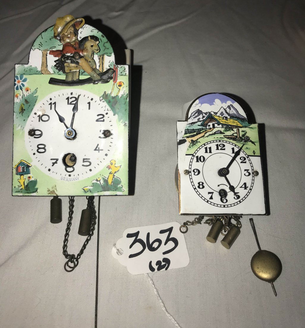 HANDCRAFTED JEWELRY, STERLING AND PLATED SILVER, CLOCKS: (2) Clocks: miniature German wag-on-the wall clock w/mechanical child on rocking horse having an enameled face and dial w/pendulum and weights, 4" T; AND small wag-on-the wall w/enameled face and dial
