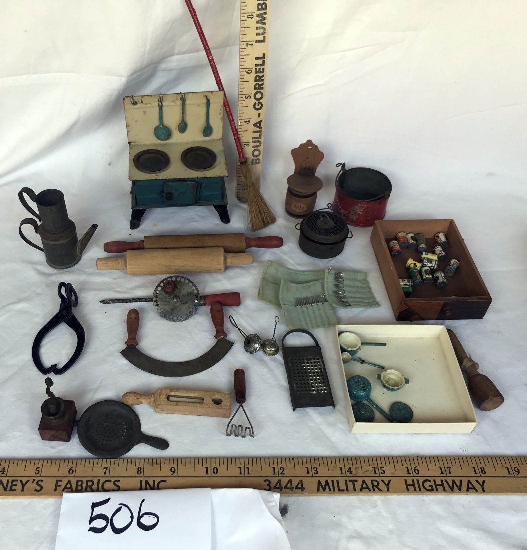 DOLLHOUSES, DOLLS, MINIATURES: Grouping of dollhouse miniatures: variety of kitchen collectibles tin stove, agate utensils, rolling pins, chopper, ice tongs, mashers, coffee grinder, salt box, group of cans, flatware, tin strainer