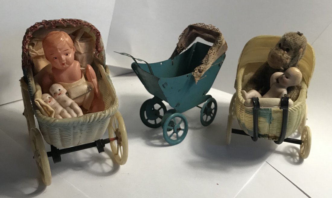 DOLLHOUSE, DOLLS, MINIATURES: Grouping of 3 doll carriages and contents including: blue tin carriage with cloth hood, unmarked, cloth hood discolored, showing age, tin does show some age marks, wheels and rods are slightly bent, 3