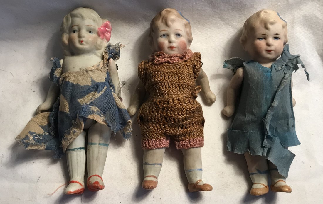 DOLLHOUSE, DOLLS, MINIATURES: Group of 3 bisque/porcelain dolls including: 2 marked P23 Made in Germany (possibly Limbach), both with molded hair having a blue ribbon, handpainted faces, jointed arms and legs, 1 dressed in blue cr