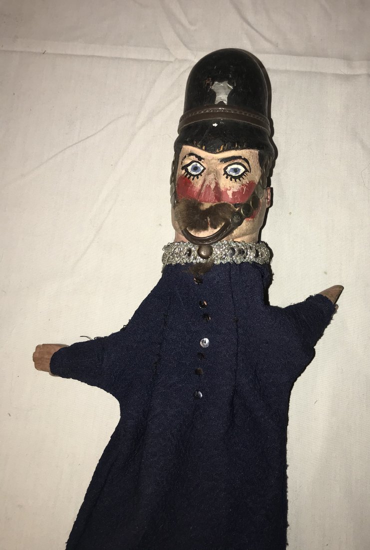 DOLLHOUSE, DOLLS, MINIATURES: Vintage English "bobbie" policeman puppet w/handpainted carved wooden head, hat and face w/mustache, wooden hands w/blue cloth uniform and hat, head shows some chipping and paint loss, some chipping v