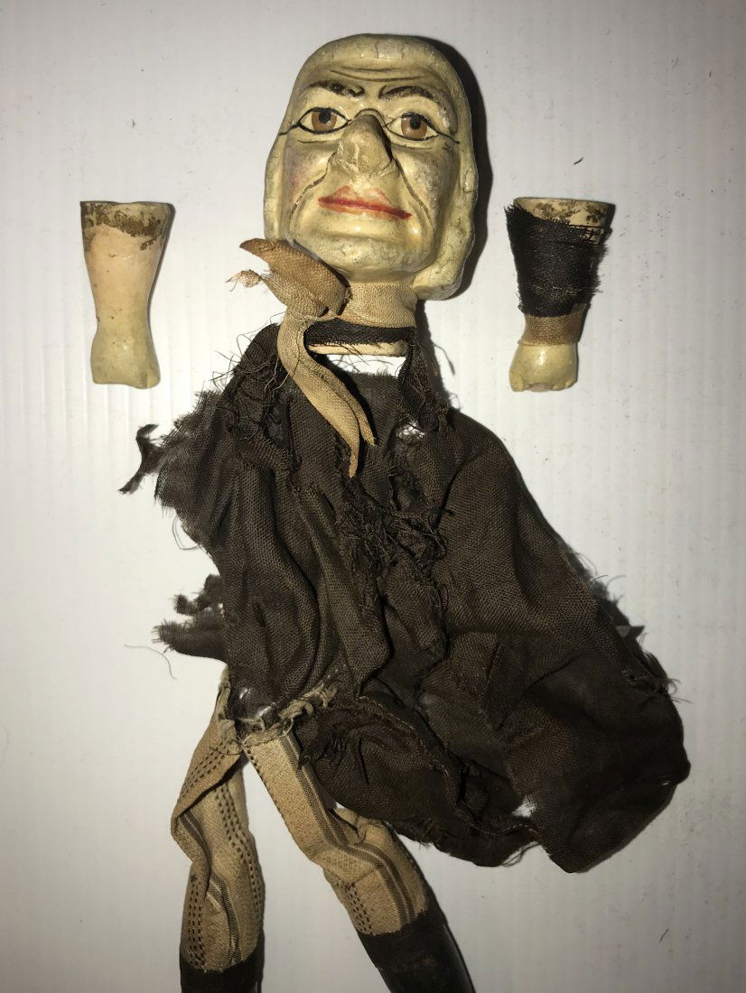 DOLLHOUSE, DOLLS, MINIATURES: Vintage puppet, figures of a man w/carved wooden head having handpainted should length hair and face, wooden hands, legs and feet cloth body w/brown shirt and striped pants, fabric shirt badly torn an