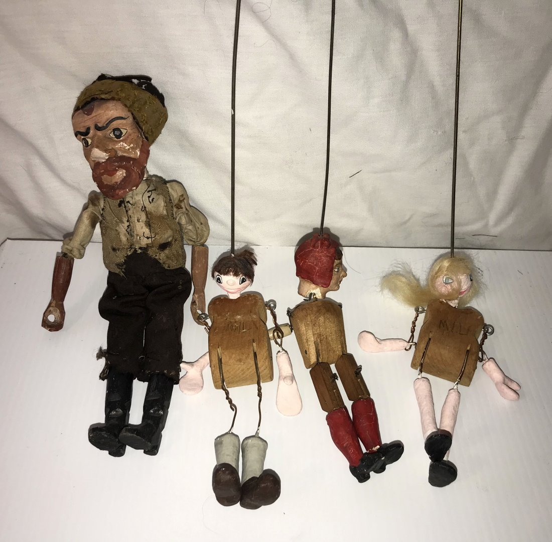 DOLLHOUSE, DOLLS, MINIATURES: Grouping of 5 marionettes: a vintage figure of a young man having a carved wooden head w/handpainted face and hat, wooden jointed body w/wire handle attached to head, chip visible at base of neck on r