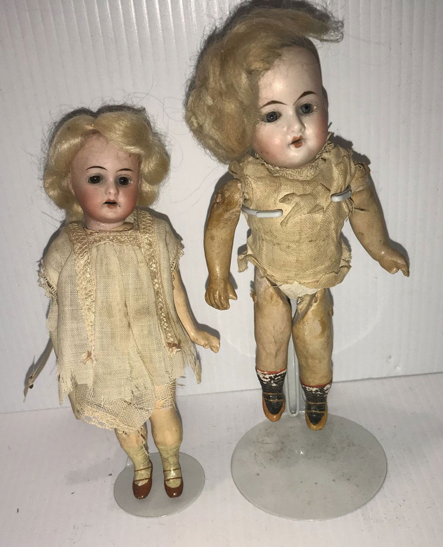 DOLLHOUSE, DOLLS, MINIATURES: Grouping of (2) vintage German bisque head dolls: girl w/"crossed swords" mark #201.21/0, handpainted face w/sleepy eyes, composition jointed body, blonde hair, partially clothes, hair is loose from h
