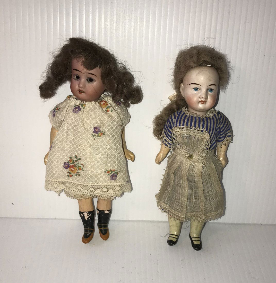 DOLLHOUSE, DOLLS, MINIATURES: Grouping of 2 vintage German bisque head dolls: a girl marked 1909 DEP #R 18/0, handpainted face w/sleepy eyes, brown hair, composition jointed body, clothed, some paint loss on socks, approx. 6 1/2"