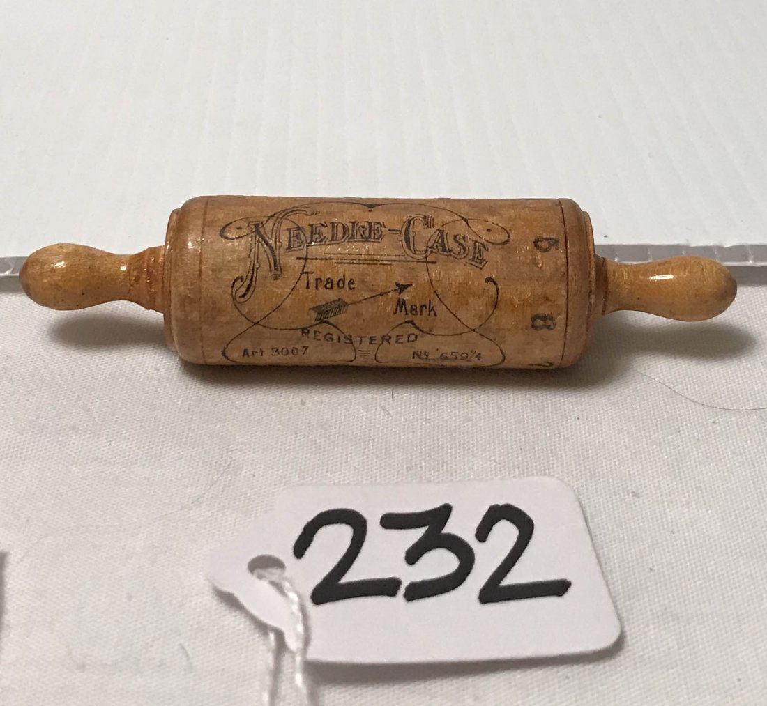 FURNITURE, ACCESSORIES, COUNTRY COLLECTIBLES, TOYS, ETC: Wooden needle case in shape of rolling pin, needles released through "pin hole" marked 4, 5, 6, 7, 8, shut, case read "Needle Case Trademark Registered Art 3007, No. 659/4, marked made in Germany, fin