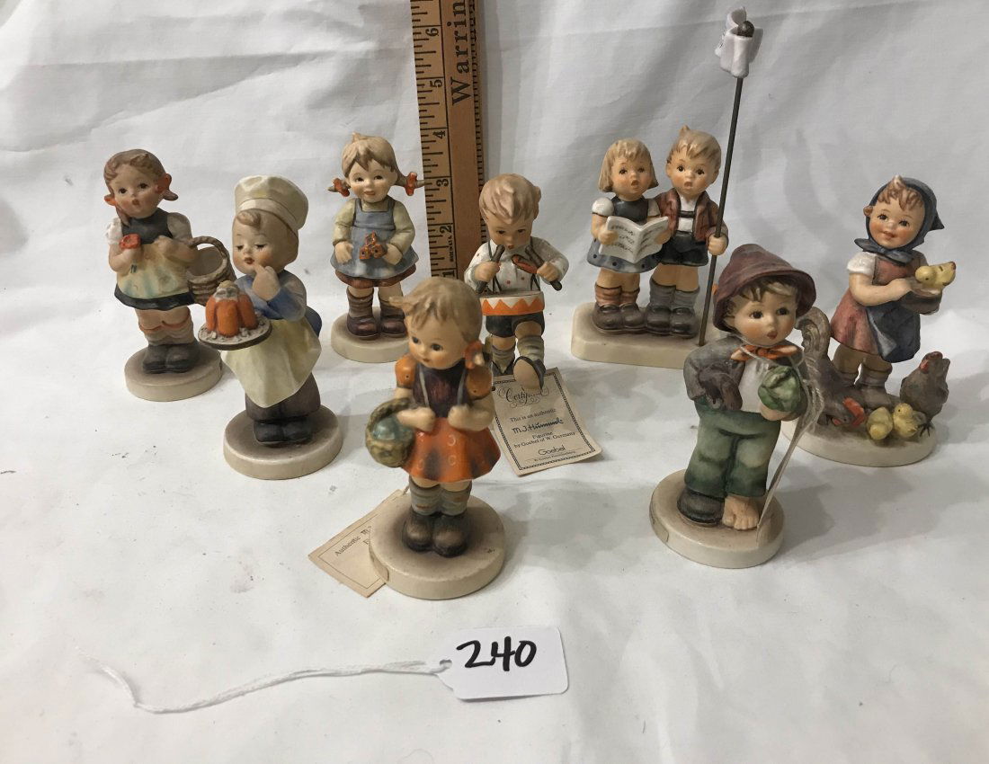 HUMMEL FIGURINES: Grouping of 8 Hummels: #81 2/0 School Girl; #98 2/0 Sister; #128 Baker; 199/0 Feeding Time; #240 Little Drummer; #374 Lot Stocking; #548 Flower Girl; #548 Flower Girl - various marks