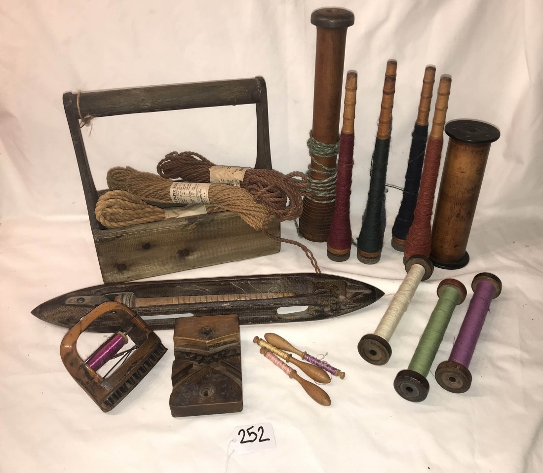 FURNITURE, ACCESSORIES, COUNTRY COLLECTIBLES, TOYS, ETC: Group of sewing items: wooden spindles, wooden spools, shuttle, vintage wooden loom clothing label maker marked Rieh and Son 280B, 3 1/2" T x 4 1/2" L x 2 3/4" W AND reproduction carrier w/grouping of